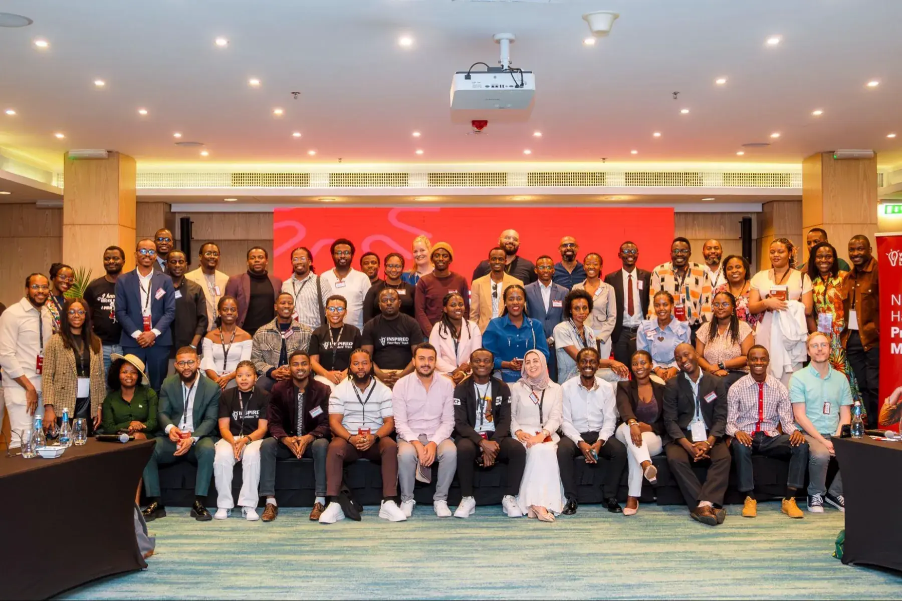 A PLA cohort gathered for a group photo in the conference hall